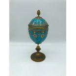 A Victorian gilt metal and blue porcelain lidded goblet, In the style of a Febrege egg, Ornately