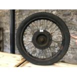 Vintage motorbike wheel with original tyre