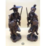 A Pair of antique Chinese hand carved figures.