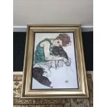 A Large framed print after Egon Schelle dated 1917. Of a lady seated. Framed with a thick gilt