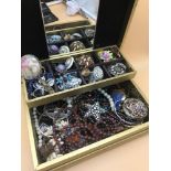 A jewel box filled with vintage bejutery . Includes brooche, necklaces and Victorian mourning ornate