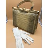 A Vintage Albino crocodile leather hand bag together with vintage French white gloves.