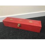 A Red Royalty box stamped with two crowns and ER initials. Scroll Box.