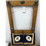An antique Masonic picture frame designed with Corinthian columns and the all seeing eye symbol.