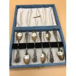 A Set of 6 Sterling silver rose handled tea spoons.