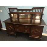 A Victorian Maple & Co London Sideboard with mirror backing. fitted with 2 central drawers and