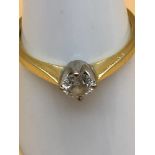 18ct gold ladies ring set with a single diamond .35 carat. Size P. Weighs 2.81grams.