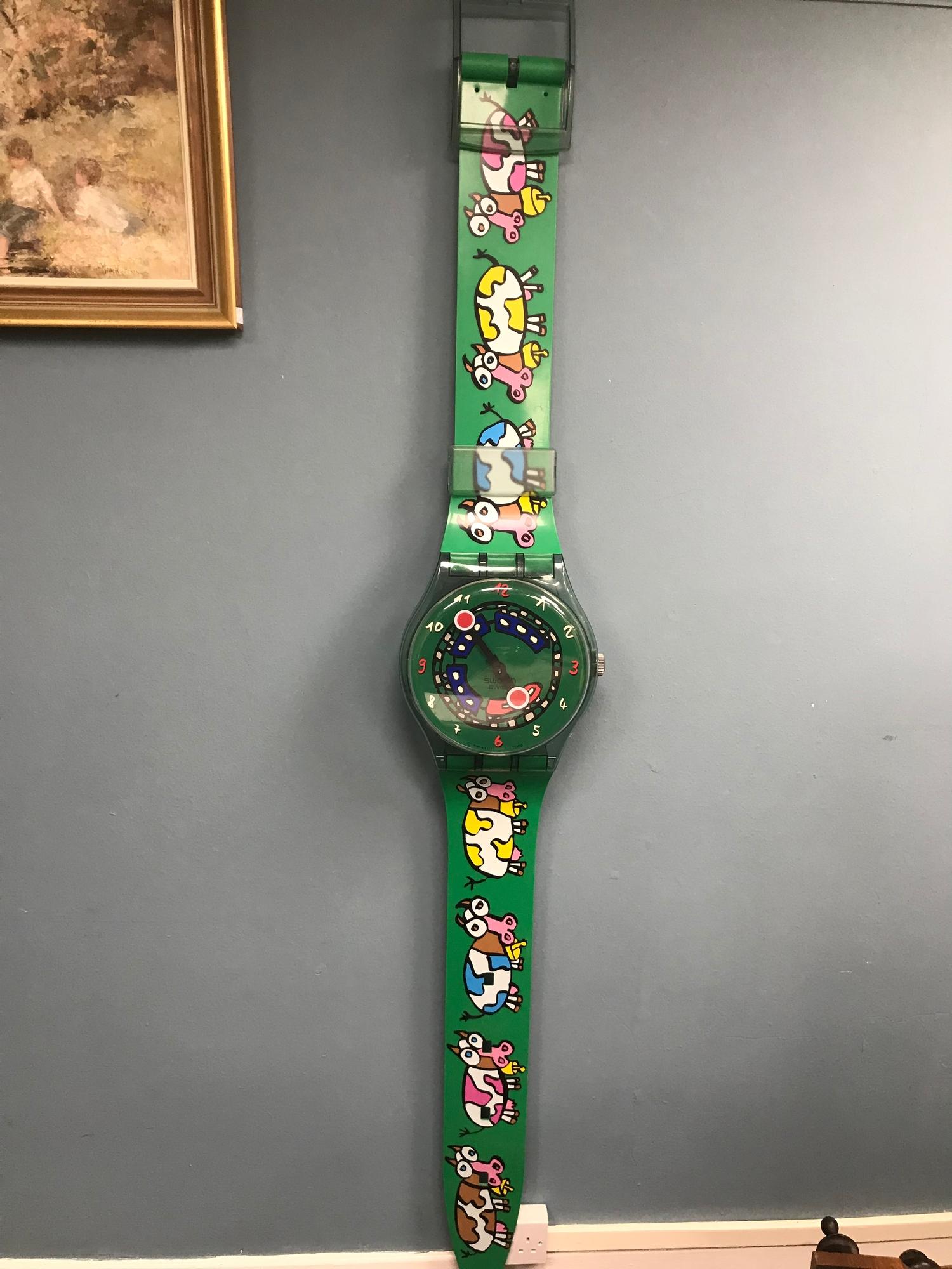 A Large Swatch watch shop adverting clock. Measures 200cm in length. Working.