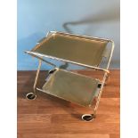 A Vintage two tier serving trolley. Folds down for easy storage. Good for serving up the Christmas