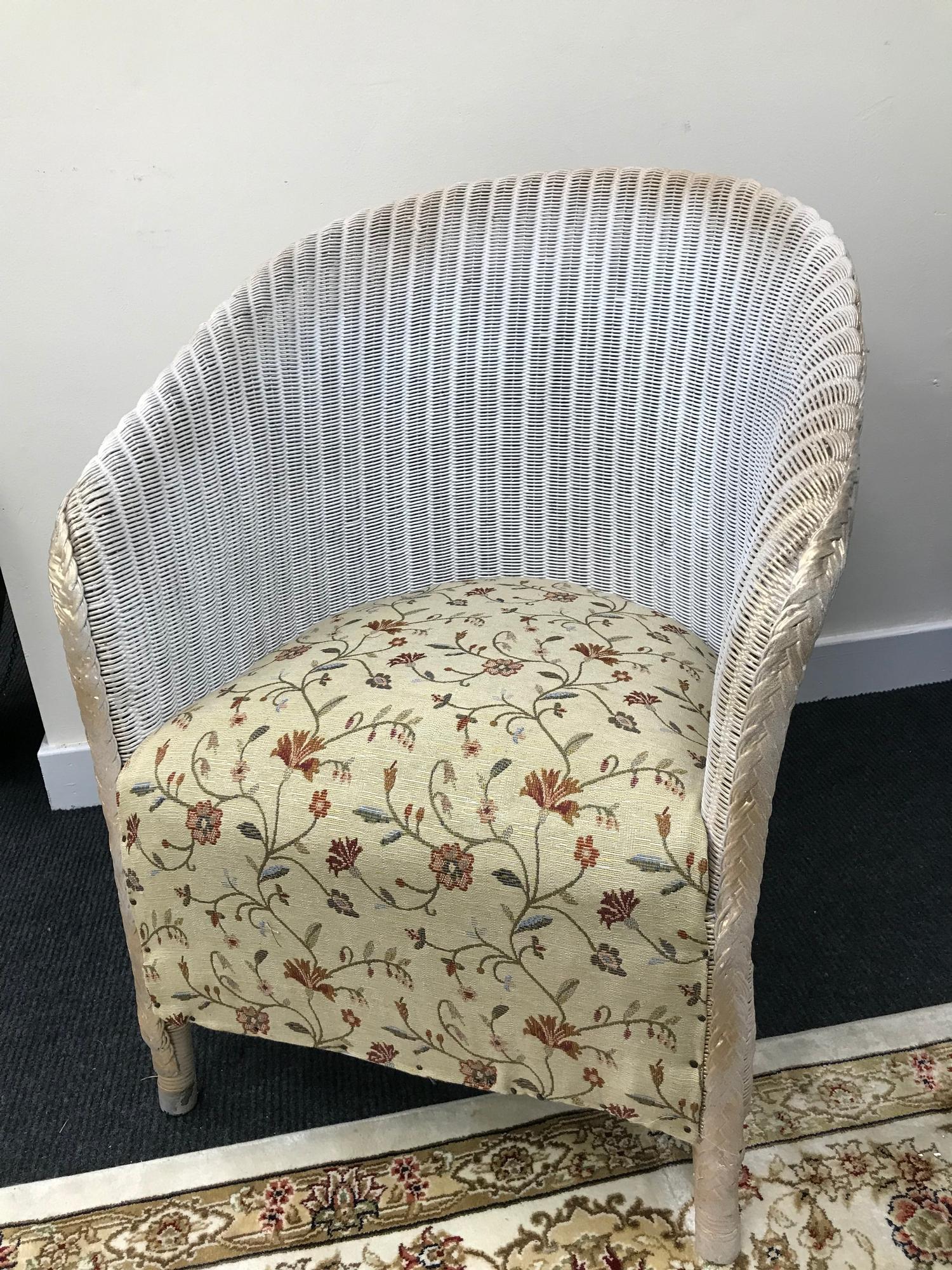 A Vintage Llyod loom style bedroom chair.