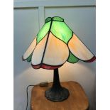 A Large Tiffany style stainglass table lamp with bronze base. Working. 50x30x30cm