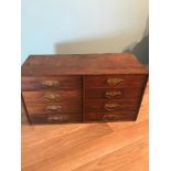 Antique table top 8 drawer chest. Measures 32x60x24.5cm