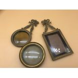 A lot of 3 regency miniature photo frames. 2 ornately designed with ribbons and foliage to the tops.