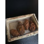 A lot of 4 Antique Chinese hand carved Coquilla nuts. Kept within a small case. (Sealed)