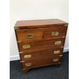 A Reproduction campaign chest of drawers. Fitted with brass fitments. Measures 74x61.5x30.5cm