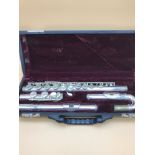 A Silver plated "Saramande" curved head flute, with travel case.