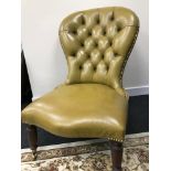 An antique Chesterfield mustard leather smokers spoon back parlour chair.