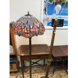 A Tiffany style floor standing lamp, Fitted with a dragon fly design shade (Repaired) together