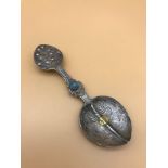 An Antique Fine Silver hand made spoon, Deigned with a turquoise stone to the handle. Has an 18ct-