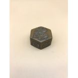 A small Japanese snuff/ pill box styled with Lotus flowers and various others. Measures 1.8x3.5cm