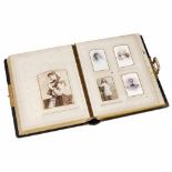 Photographic Album with Musical Movement, c. 1900Brown leather-bound album with brass fittings, with