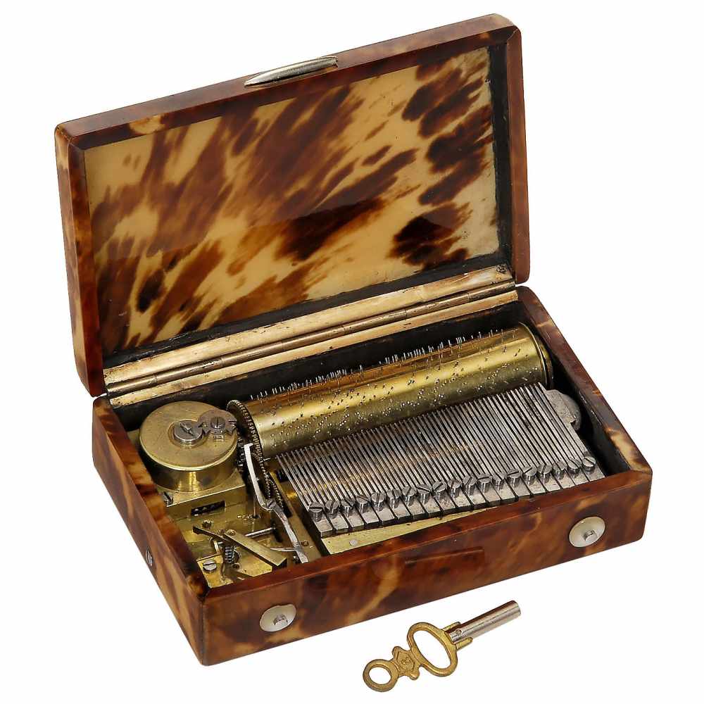 Early Musical Snuff Box, c. 1820Stamped "IM", playing two airs, with sectional comb of 57 teeth in