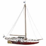 Model Sailing Ship, c. 1960Red-and-white-lacquered metal hull, wood masts, brass rudder, length 32