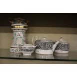 A Wedgwood teapot and sugar bowl decorated with a broad band scroll work in black transfer, a