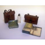 Two leather cases one marked Finnigans Manchester & Liverpool containing silver plated sandwich