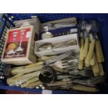 Two sets of fish eaters and other cutlery, napkin rings and a pair of candlesticks (One box)