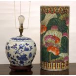 A pair of Chinese blue and white decorative table lamps and a cylindrical vase, damaged (sold as