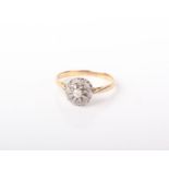 An 18ct gold and diamond cluster ring, the central diamond 0.07ct approx. 2.8g in total