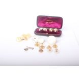 A quantity of gold and pearl collar studs and cuff links