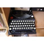 Typewriter; A Remington portable circa 1930's with instruction manual