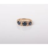 A modern 9ct gold, sapphire and diamond carved half-hoop style ring, circa 1973, size M, 2.8g gross