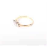 A diamond three stone ring, the graduated old-cut stone approx. 0.45cts, total claw set in white and