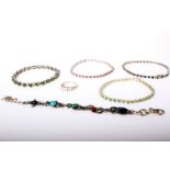 A QVC silver and small round pale emerald set line bracelet together with two similar bracelets