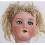 An Armand Marseille bisque head doll 390 with swivel blue eyes and jointed body, 58cm