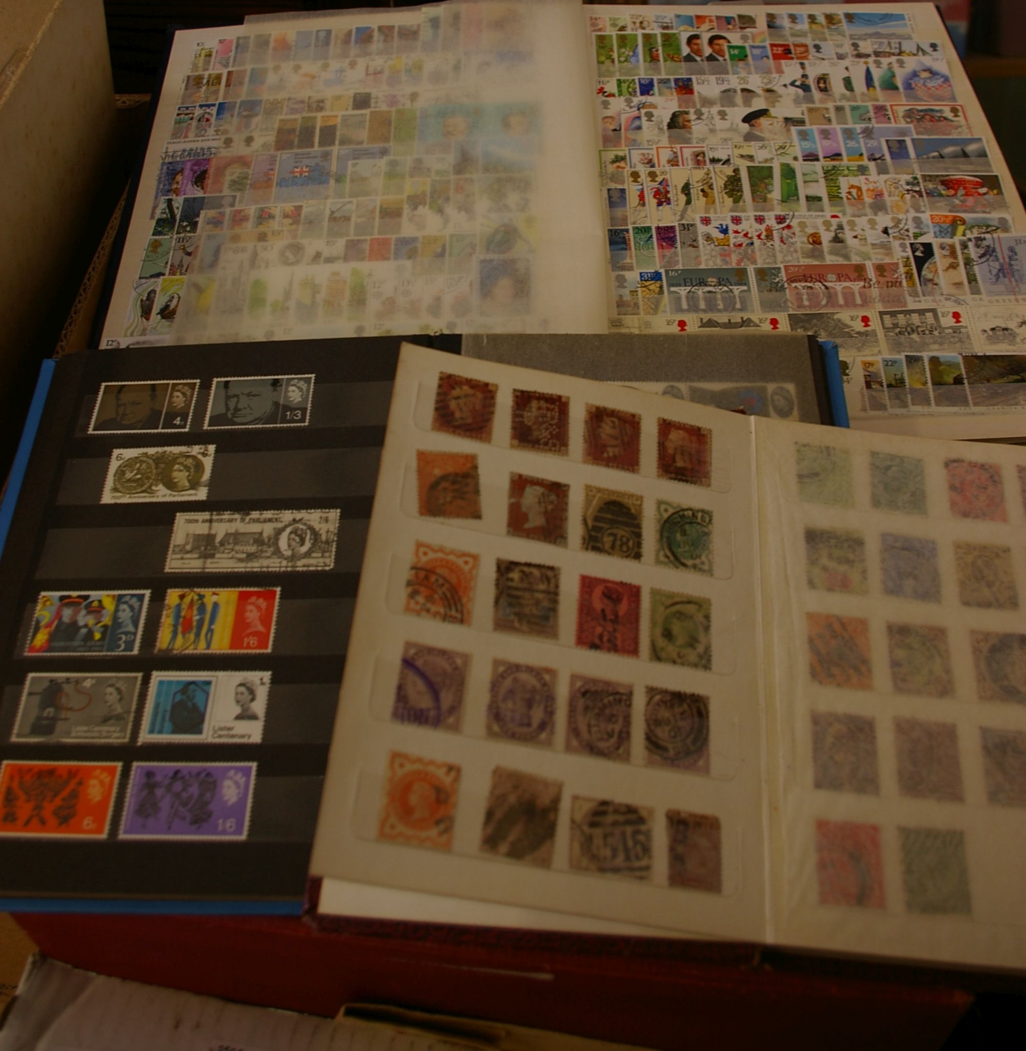 A collection of postcards, three albums and loose Edwardian to modern, an accumulation of stamps-