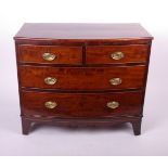 A George III mahogany bowfront chest of four drawers on swept bracket feet 82cm high, 98cm wide