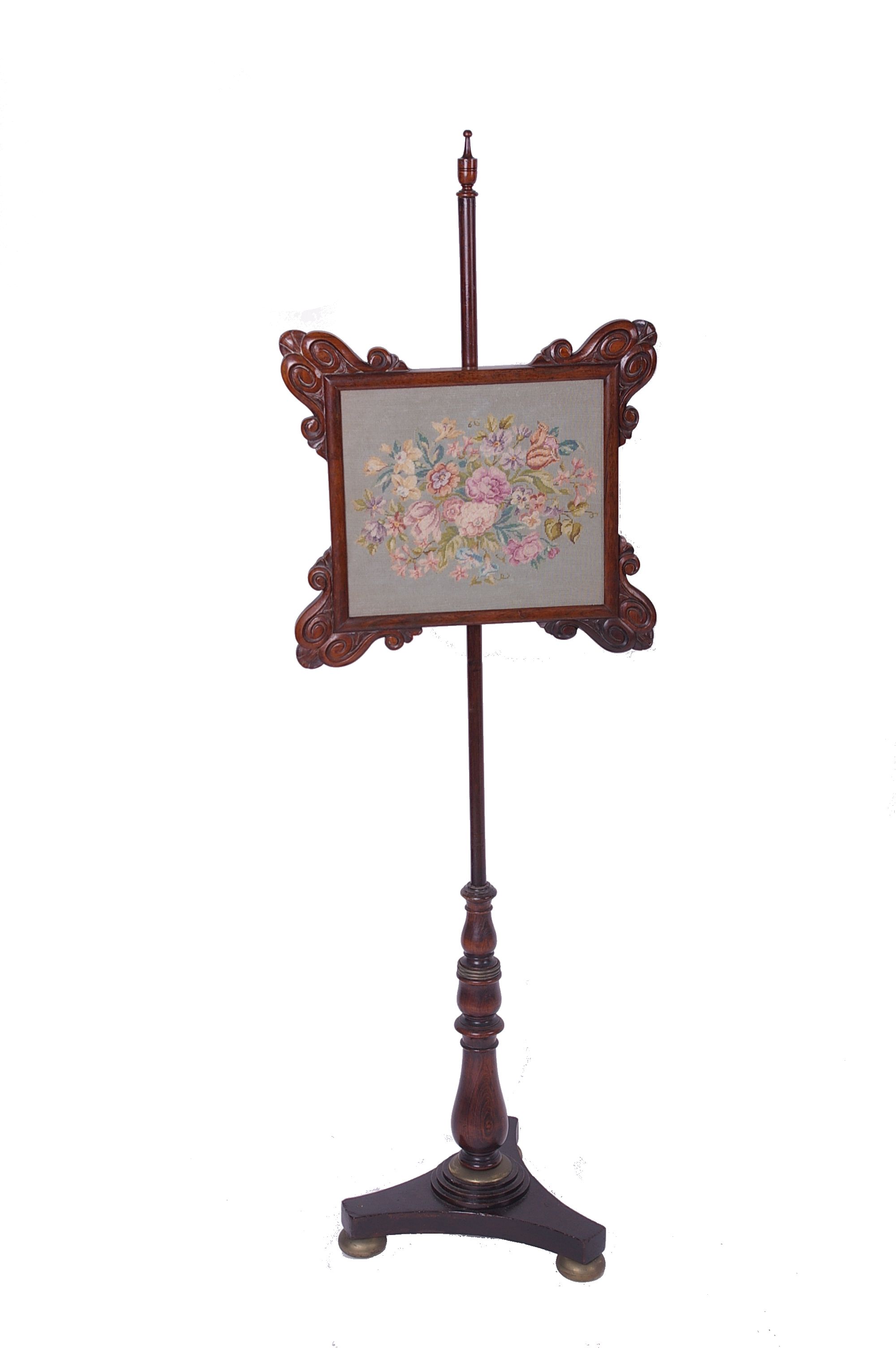 A George IV rosewood polescreen with an adjustable needlework panelH: 138cms