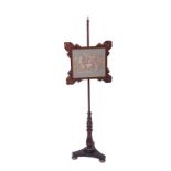 A George IV rosewood polescreen with an adjustable needlework panelH: 138cms