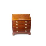 A 19th century mahogany slope front bureau, wide banded in satinwood, with a well fitted interior.