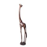 A good wooden carving of a tall giraffe with stain patterning on circular base. Modern 220cm high