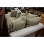 A modern white three seater sofa 250cm length