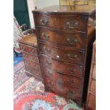 A George III style mahogany serpentine six drawer chest and another smaller bedside chest