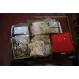 Two boxes of part-sorted used stamps - mostly paper backed. World wide stamps