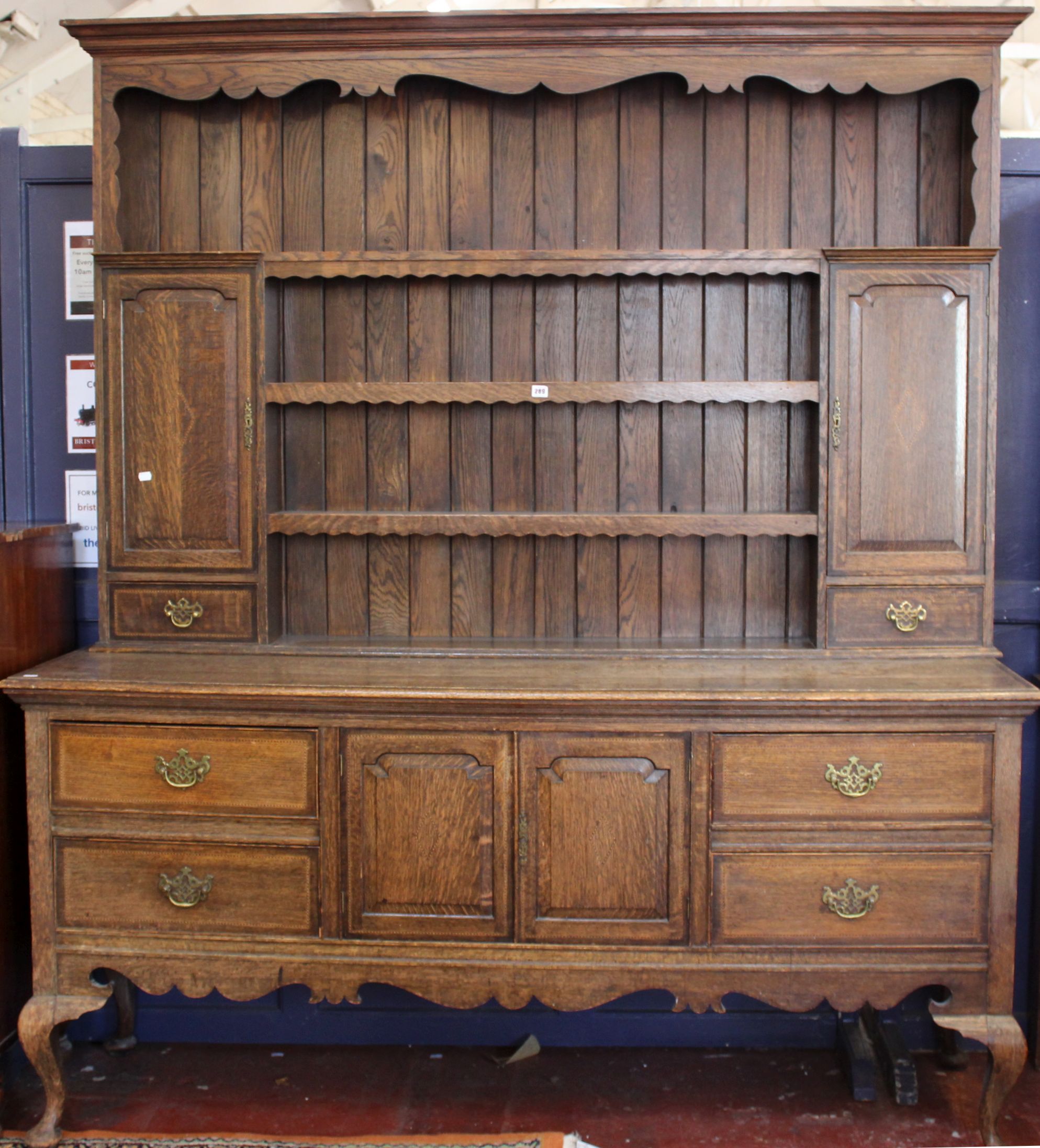 A George III style oak two part dresser with parquetry stringing 220cm high, 190cm wide