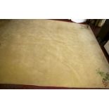 A modern ivory ground carpet with stylized decoration 270 x 370cm