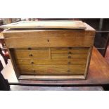 A Neslein engineers oak tool box, fitted drawers with key; an oak storage box, two mantle clocks and